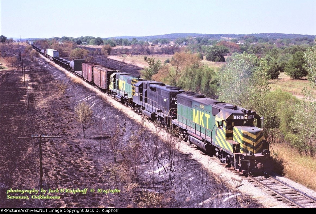 MKT 208-Conrail 8153-MKT 317, is northbound after a brush fire at Savanna, Oklahoma. August 24, 1980.